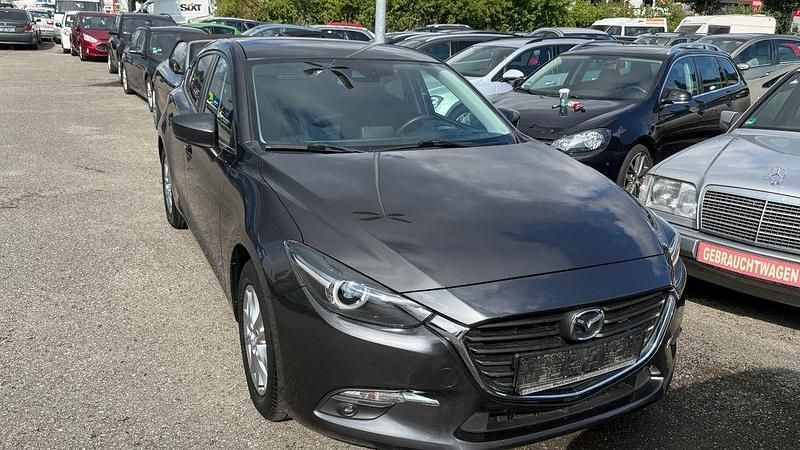 Grau Gebraucht 2017 Mazda 3 Exclusive-Line Limousine | 11.999 € (Fairer Preis) - Bild 1/4