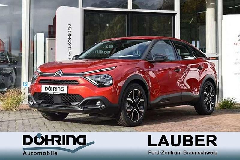 Elixirrot Gebraucht 2023 Citroën e-C4 Feel Limousine | 23.450 € (Fairer Preis) - Bild 1/4