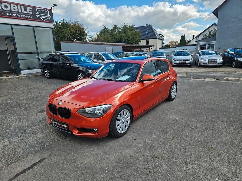 Orange Gebraucht 2012 BMW 116 Comfort Edition Kleinwagen | 8.490 € (Guter Preis) - Bild 1/4