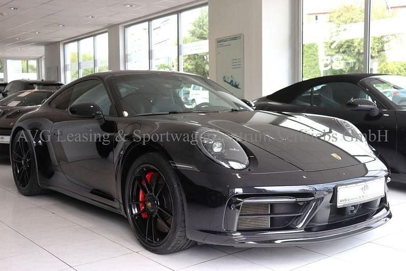Tiefschwarzmetallic Gebraucht 2024 Porsche 911 Carrera 4 GTS Coupé | 144.800 € (Superpreis) - Bild 1/4