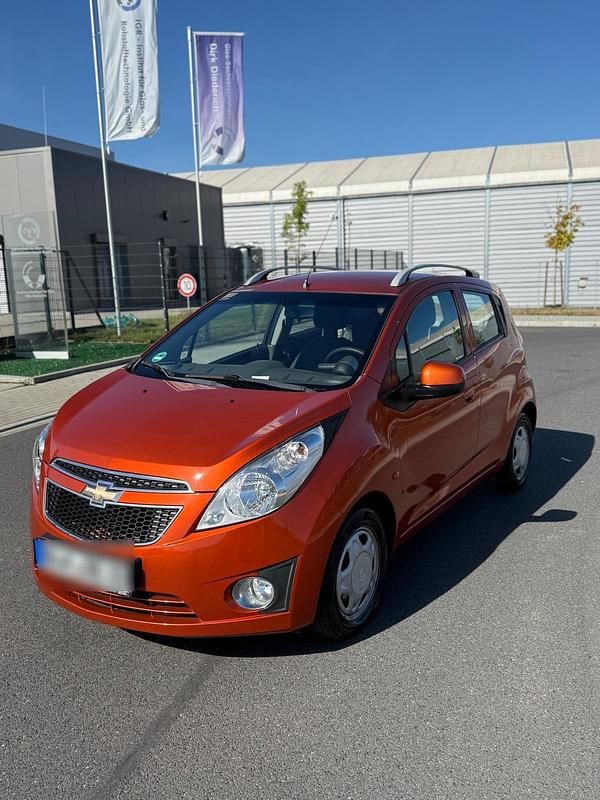 Orange Gebraucht 2010 Chevrolet Spark Kleinwagen | 1.599 € (Fairer Preis) - Bild 1/4