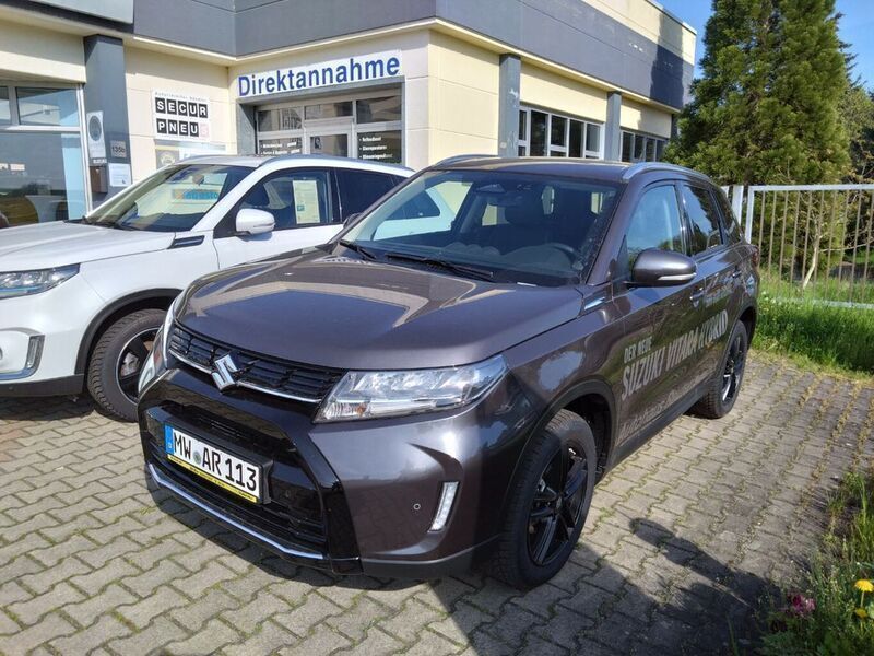 Grau Gebraucht 2024 Suzuki Vitara Comfort+ SUV | 25.310 € (Etwas zu teuer) - Bild 1/4