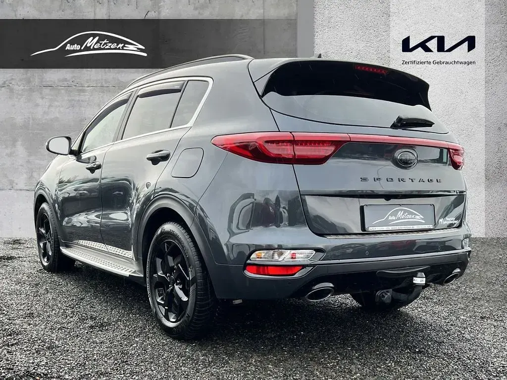 Gebraucht Kia Sportage 177 PS (130 kW) 2021 H8g) pentametal met. (grau SUV