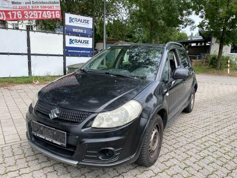 Schwarz Gebraucht 2010 Suzuki SX4 Limousine | 1.699 € - Bild 1/4