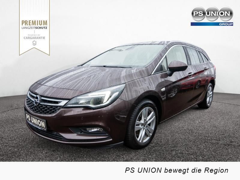 Braun (metallic) Gebraucht 2018 Opel Astra Kombi | 11.550 € (Fairer Preis) - Bild 1/4