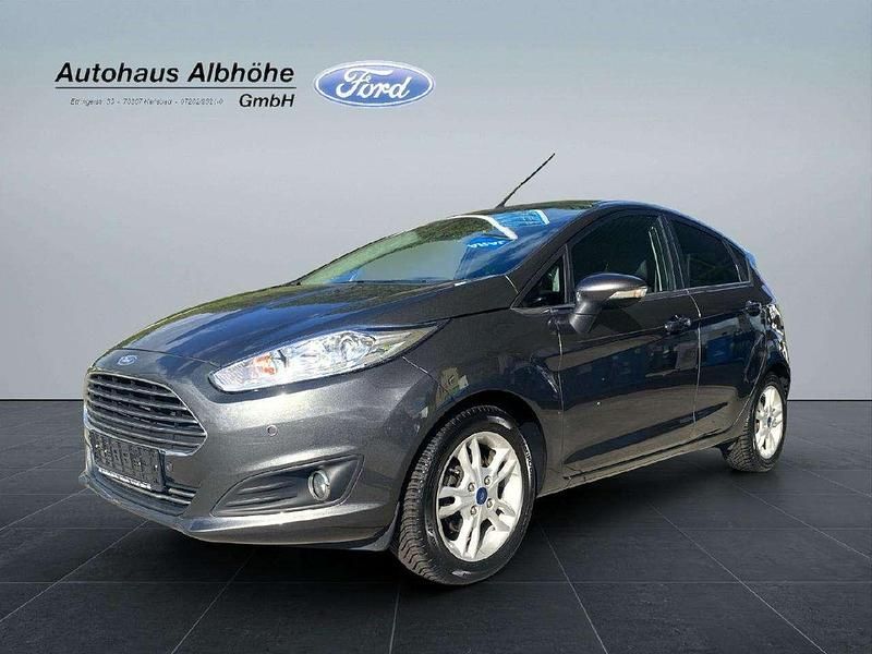 Magneticgrau (metallic) Gebraucht 2015 Ford Fiesta Titanium Kleinwagen | 6.990 € (Fairer Preis) - Bild 1/4