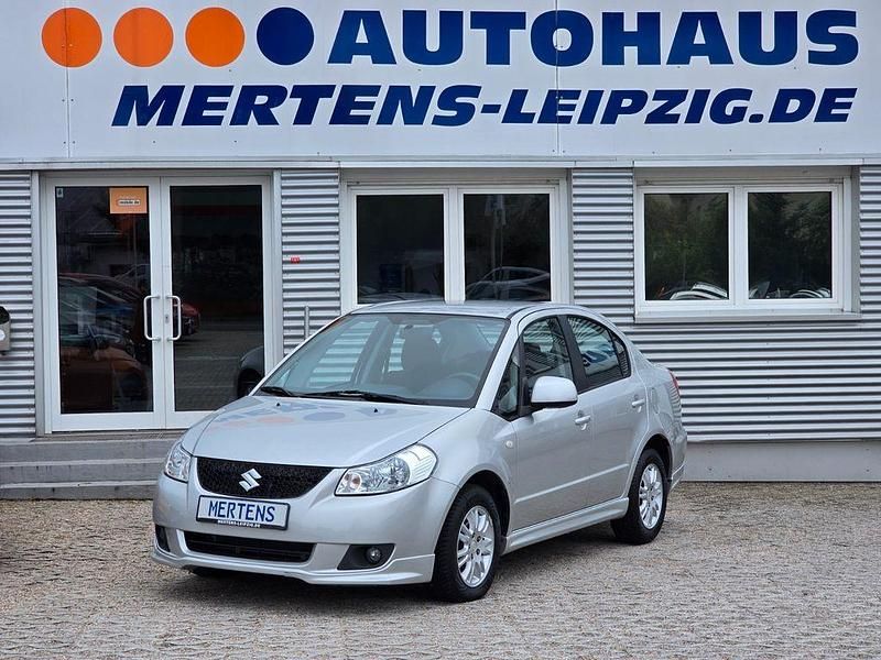 Silber Gebraucht 2009 Suzuki SX4 Comfort Limousine | 6.990 € (Fairer Preis) - Bild 1/4