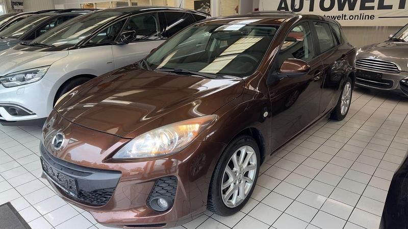 Używany Mazda 3 Edition 105 KM (77 kW) 2012 Brązowy Sedan/Limuzyna