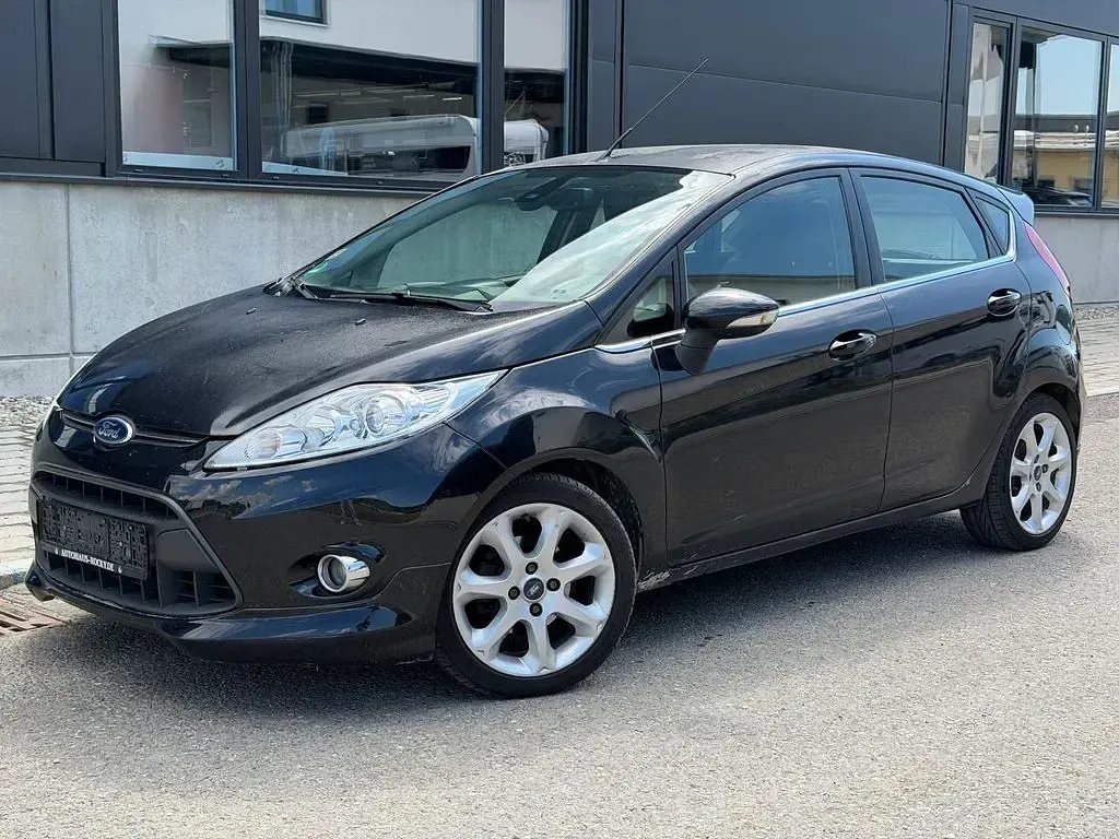 Gebraucht Ford Fiesta Titanium 95 PS (69 kW) 2011 Pantherschwarz metallic Limousine