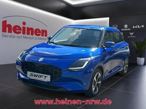 Gelb (cool yellow / mineral gray metallic) Gebraucht 2024 Suzuki Swift Comfort+ Kleinwagen | 19.480 € (Fairer Preis) - Bild 1/4