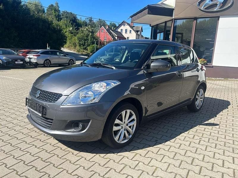 Grau Gebraucht 2013 Suzuki Swift Club Kleinwagen | 4.990 € (Guter Preis) - Bild 1/4