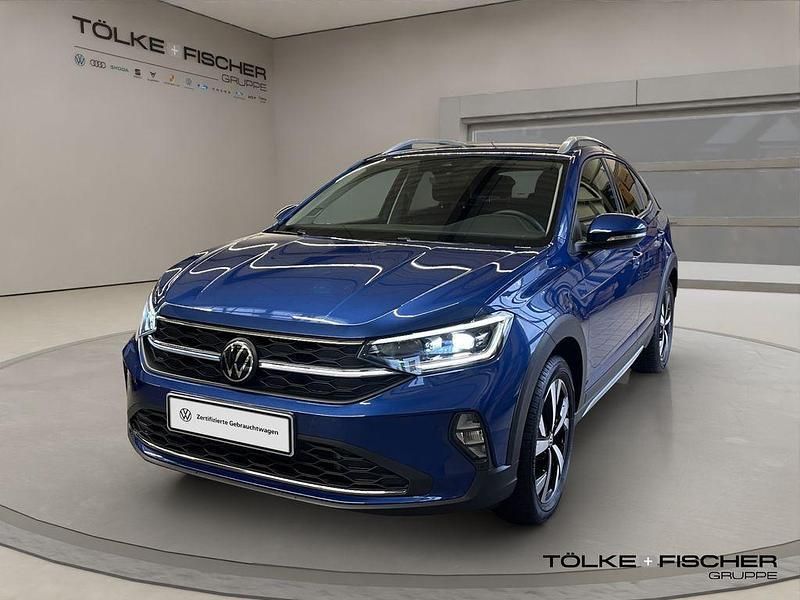 Reef blue metallic Gebraucht 2024 VW Taigo Style SUV | 27.489 € (Fairer Preis) - Bild 1/4