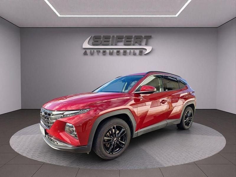 Sunset red / mic Gebraucht 2021 Hyundai Tucson Prime SUV | 27.190 € (Fairer Preis) - Bild 1/4