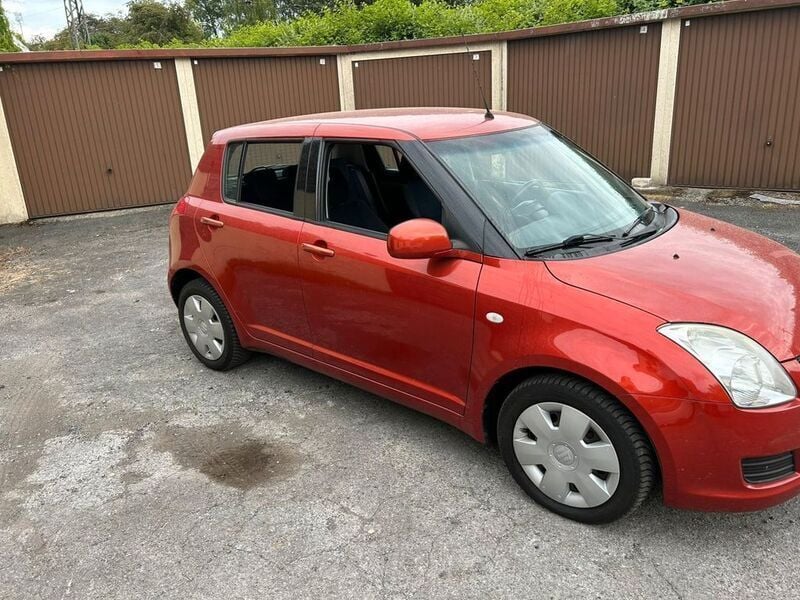 Orange Gebraucht 2009 Suzuki Swift Snow Limousine | 2.299 € (Fairer Preis) - Bild 1/4