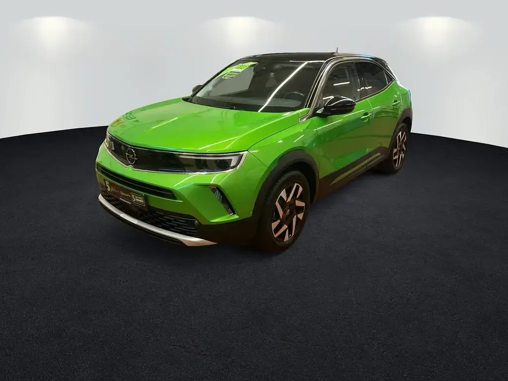 Gebraucht Opel Mokka Elegance 101 PS (74 kW) 2022 Matcha green/ikone gruen (metallic) SUV