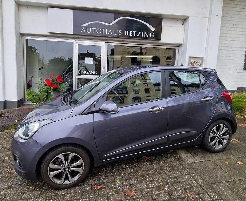 Star dust (metallic) Gebraucht 2014 Hyundai i10 Style Kleinwagen | 7.144 € (Fairer Preis) - Bild 1/4