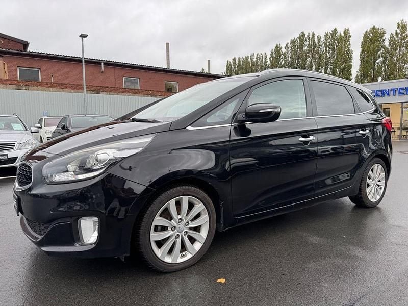 Black soul/cherry Gebraucht 2016 Kia Carens DREAM-TEAM Edition Van / Kleinbus | 8.900 € (Guter Preis) - Bild 1/4