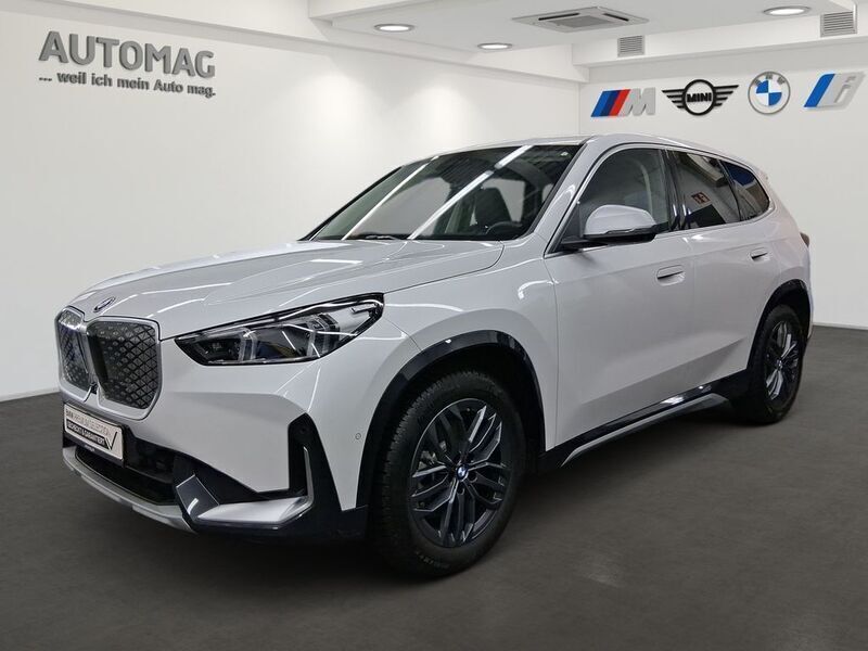Mineralweiß Gebraucht 2024 BMW iX1 Performance SUV | 48.490 € (Teuer) - Bild 1/4
