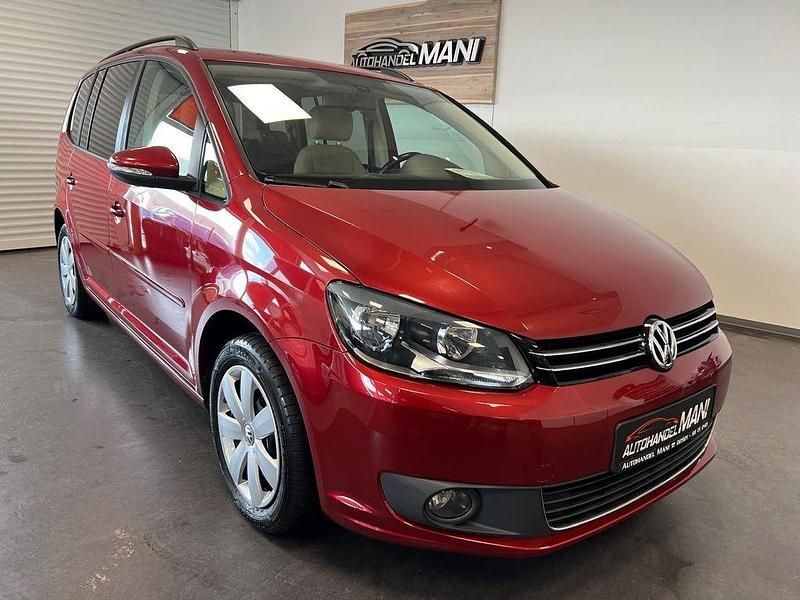 Wild cherry red metallic Gebraucht 2013 VW Touran Comfortline Van / Kleinbus | 9.490 € (Fairer Preis) - Bild 1/4