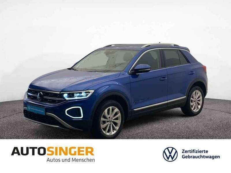 Ravennablau metallic Gebraucht 2024 VW T-Roc Style SUV | 35.430 € (Fairer Preis) - Bild 1/3
