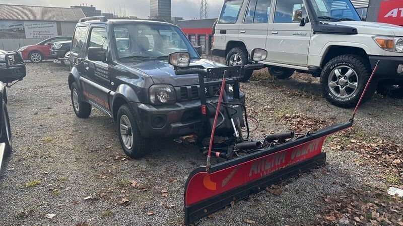 Grau Gebraucht 2013 Suzuki Jimny SUV | 12.499 € (Etwas zu teuer) - Bild 1/4