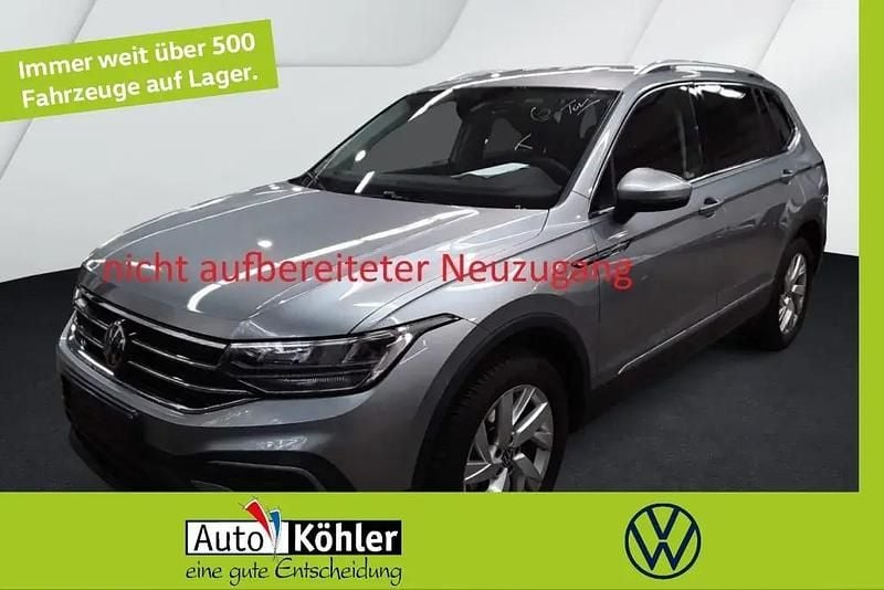 Pyritsilber Gebraucht 2024 VW Tiguan Allspace Life SUV | 34.430 € (Superpreis) - Bild 1/3
