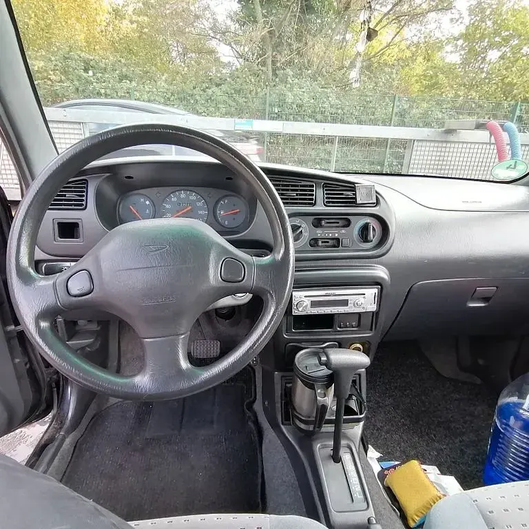 Gebraucht Daihatsu Cuore 56 PS (41 kW) 2002 Schwarz Kleinwagen