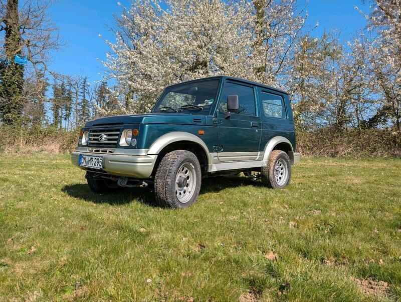 Grün Gebraucht 1999 Suzuki Samurai SUV | 7.250 € (Fairer Preis) - Bild 1/4
