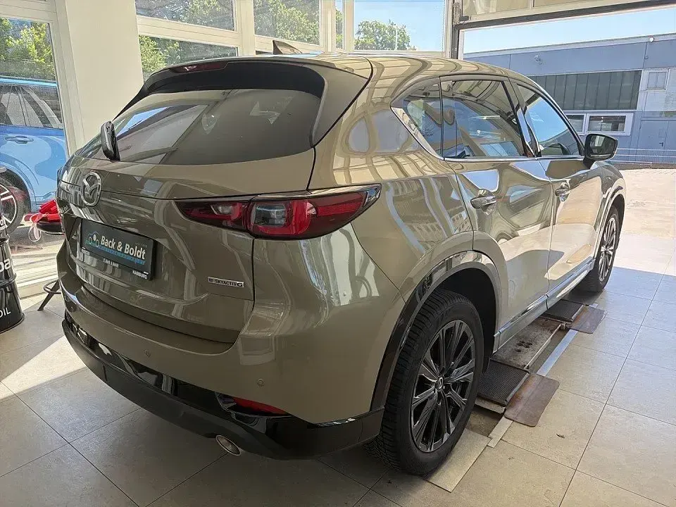 Gebraucht Mazda CX-5 Homura-Line 194 PS (142 kW) 2023 Zircon sand SUV