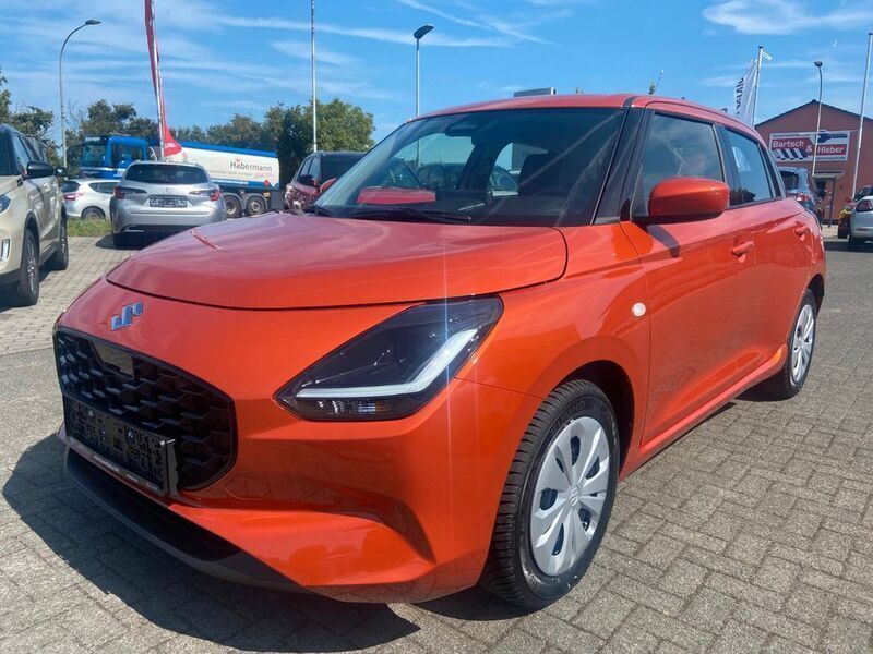 Orange Neu 2025 Suzuki Swift Club Kleinwagen | 17.490 € - Bild 1/4