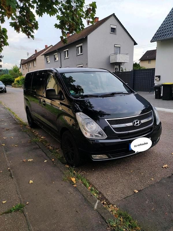 Schwarz Gebraucht 2011 Hyundai H-1 Premium Van / Kleinbus | 12.800 € - Bild 1/4