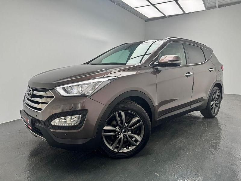 Arabian mocha / mic Gebraucht 2015 Hyundai Santa Fe Premium SUV | 16.450 € (Guter Preis) - Bild 1/4