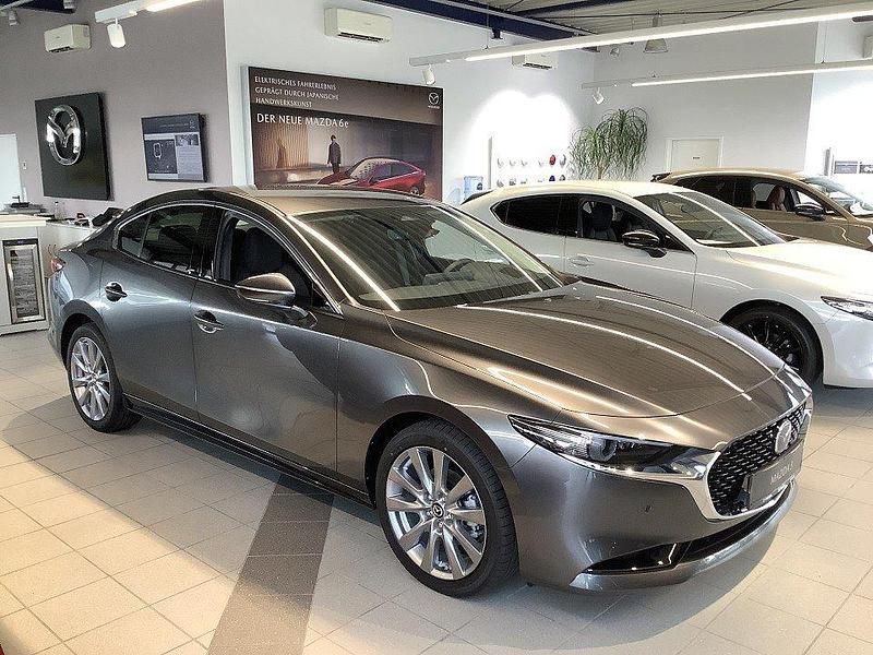 Machine gray Neu 2025 Mazda 3 Exclusive-Line Limousine | 32.280 € (Teuer) - Bild 1/4