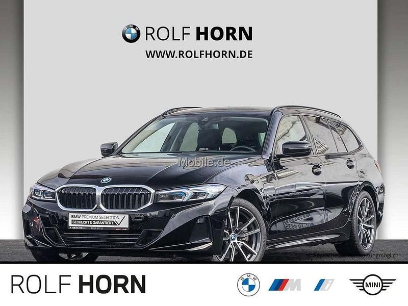 Schwarz Gebraucht 2022 BMW 320e Sport Line Kombi | 26.620 € (Fairer Preis) - Bild 1/4