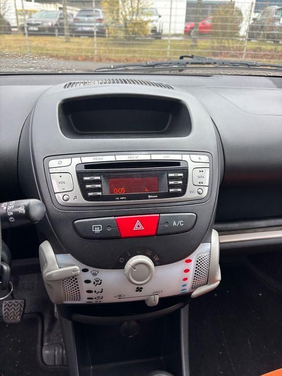 Gebraucht Toyota Aygo 68 PS (50 kW) 2013 Orange Kleinwagen