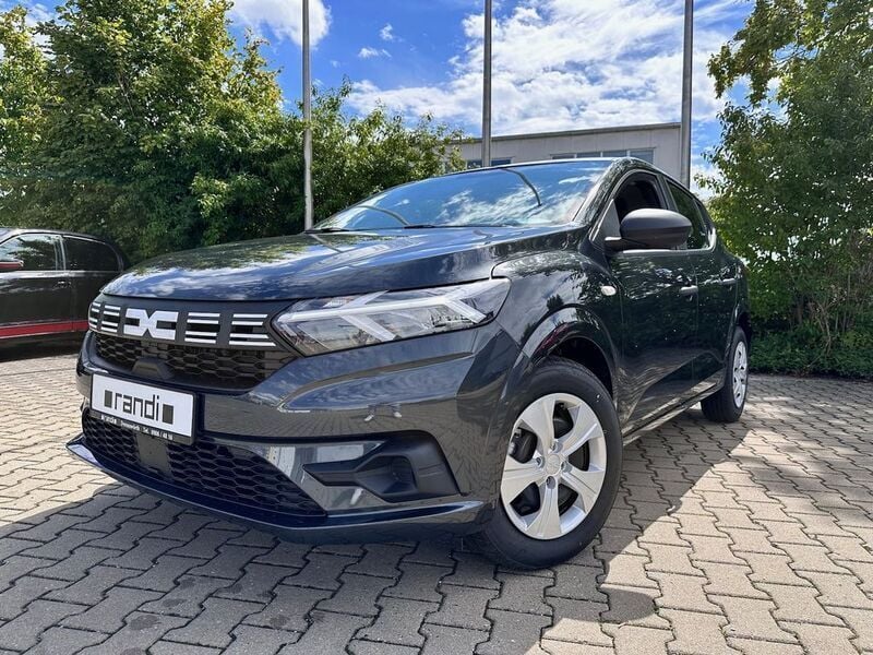 Grau Gebraucht 2024 Dacia Sandero Essentiel Kleinwagen | 15.257 € (Superpreis) - Bild 1/4