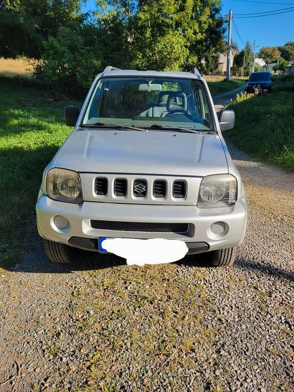 Grau Gebraucht 2001 Suzuki Jimny SUV | 4.499 € (Superpreis) - Bild 1/4