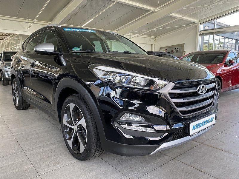 Phantom black (metallic) Gebraucht 2018 Hyundai Tucson Turbo SUV | 18.800 € (Fairer Preis) - Bild 1/4