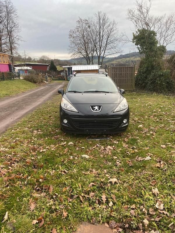 Gebraucht Peugeot 207 95 PS (69 kW) 2011 Schwarz Kombi