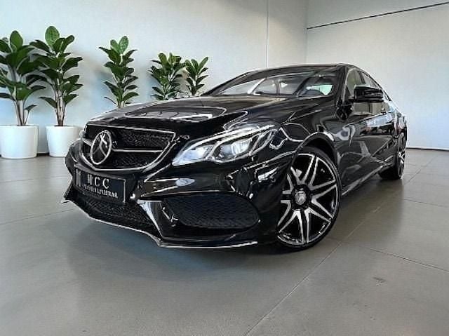 Obsidianschwarz (metallic) Gebraucht 2015 Mercedes E320 AMG Coupé | 27.990 € - Bild 1/4
