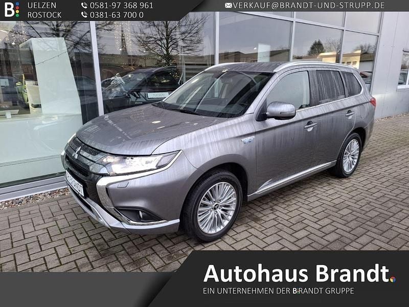 Grau Gebraucht 2021 Mitsubishi Outlander P-HEV Basis SUV | 20.990 € (Guter Preis) - Bild 1/4