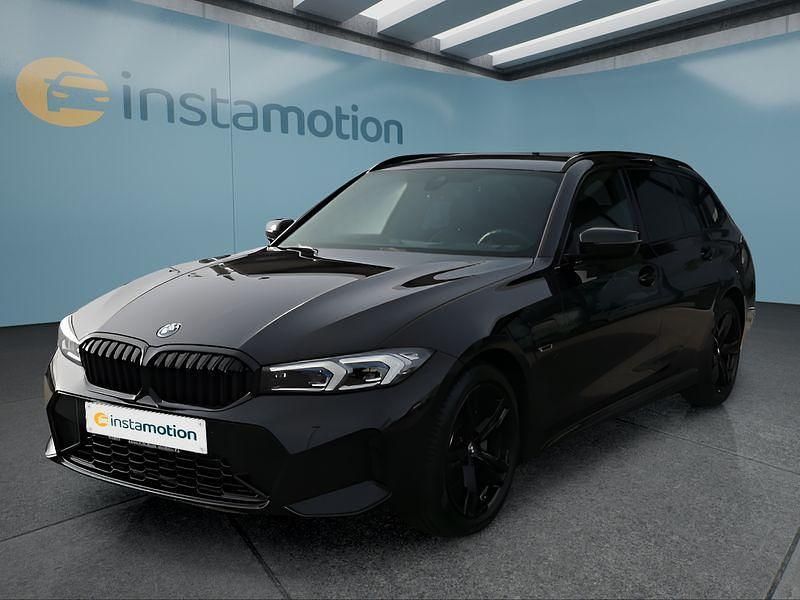 Schwarz Gebraucht 2022 BMW 320e Kombi | 35.249 € - Bild 1/4