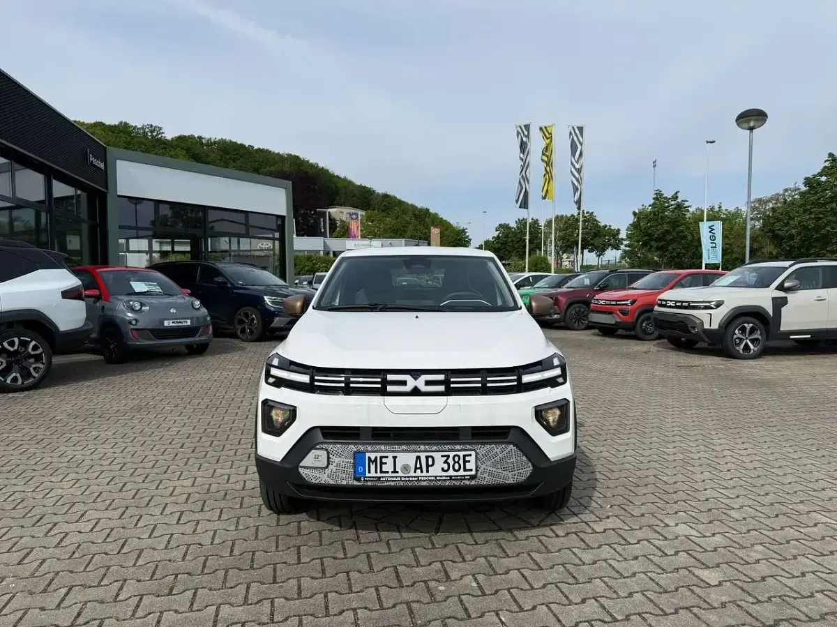 Gebraucht Dacia Spring Extreme 47 kW (65 PS) 2025 Polarweiss Kleinwagen