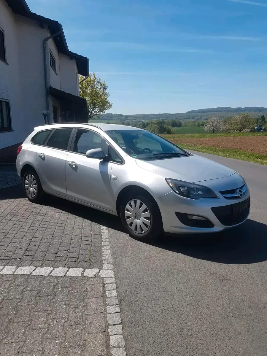 Second-hand Opel Astra 110 CP (80 kW) 2014 Argintiu Break