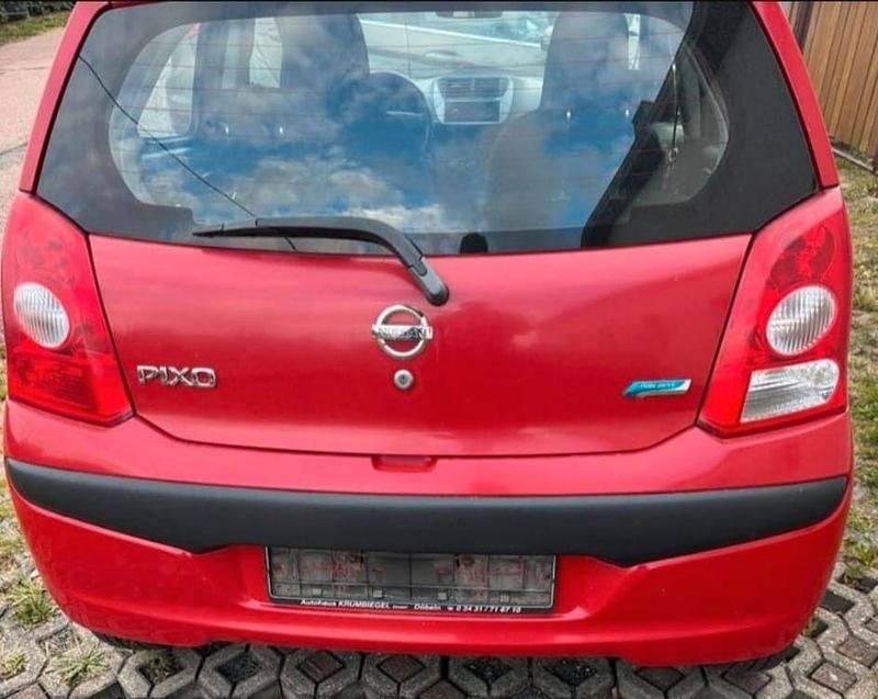 Gebraucht Nissan Pixo 68 PS (50 kW) 2011 Rot Kleinwagen