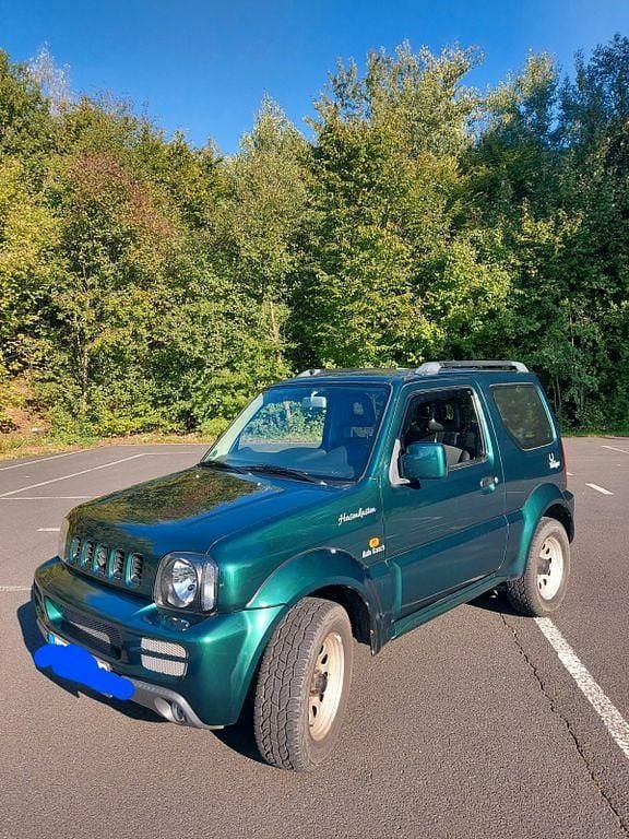 Grün Gebraucht 2005 Suzuki Jimny SUV | 6.100 € (Fairer Preis) - Bild 1/4