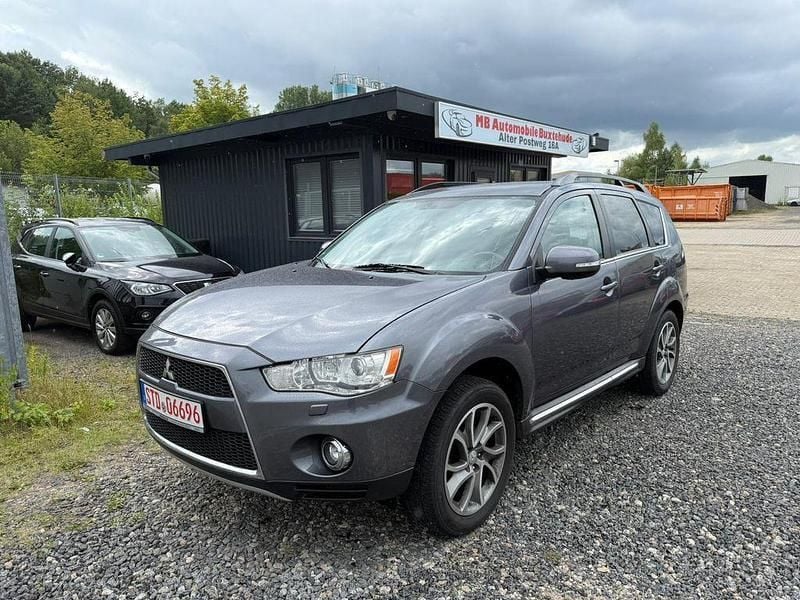 Grau Gebraucht 2012 Mitsubishi Outlander Motion SUV | 6.999 € (Fairer Preis) - Bild 1/4