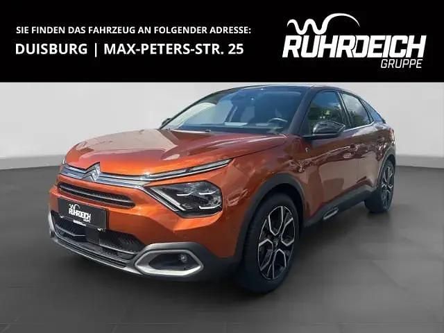 Orange Gebraucht 2022 Citroën e-C4 Shine Limousine | 17.289 € (Superpreis) - Bild 1/4