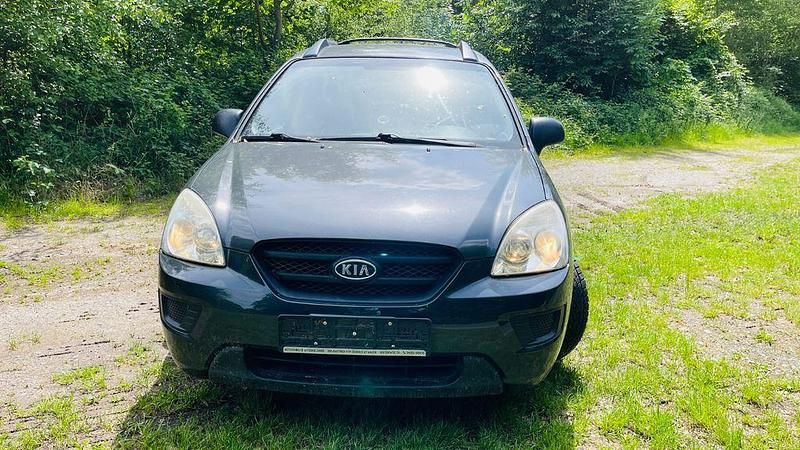 Grau Gebraucht 2008 Kia Carens LX Van / Kleinbus | 2.299 € - Bild 1/4