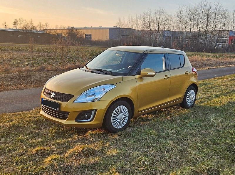Gold Gebraucht 2015 Suzuki Swift Club Kleinwagen | 6.150 € (Fairer Preis) - Bild 1/4